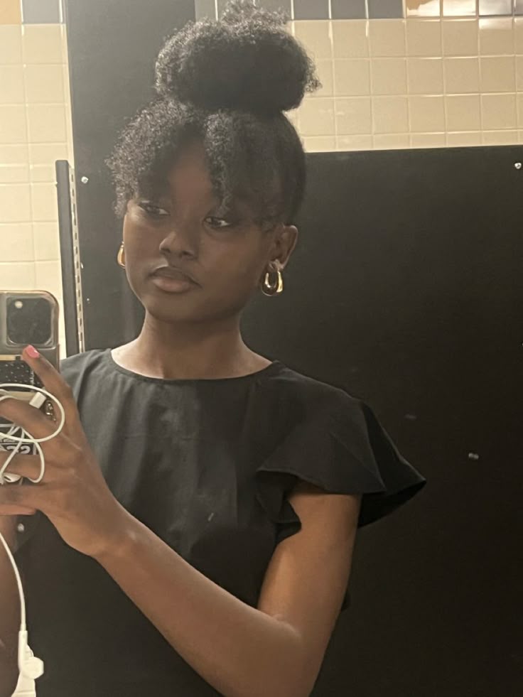 Quick top knot hairstyle for beginners with natural 4C hair.