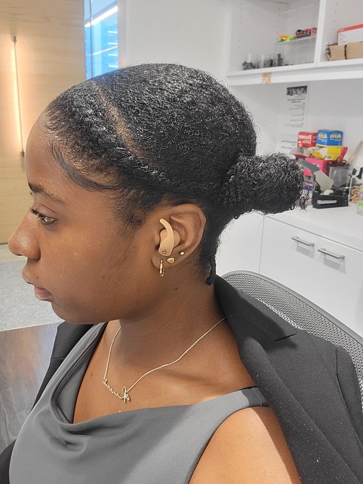 Side bun hairstyle on natural 4C hair.