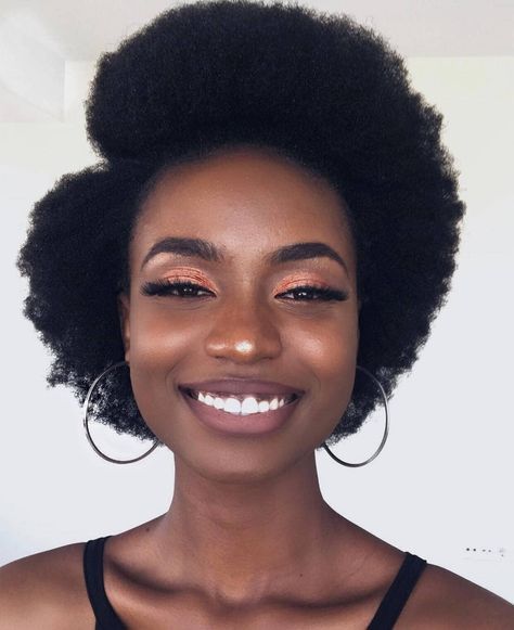 Side-part afro hairstyle for beginners with 4C hair.