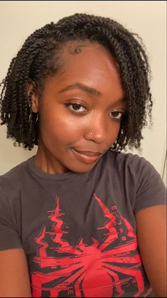 Side-swept mini twists on natural 4C hair.