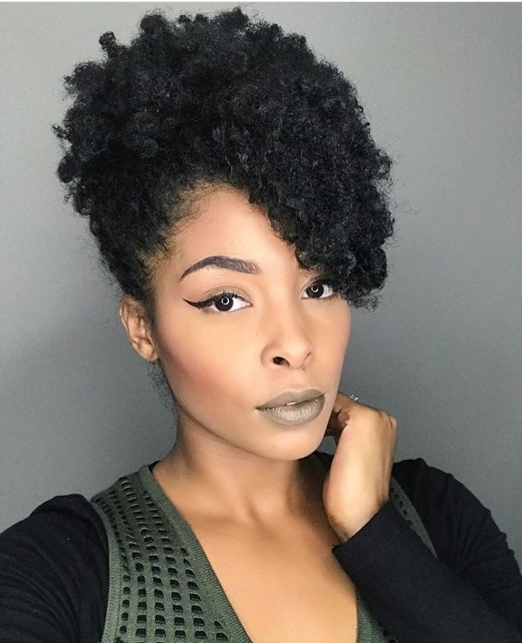 Side-swept twist-out on natural 4C hair.