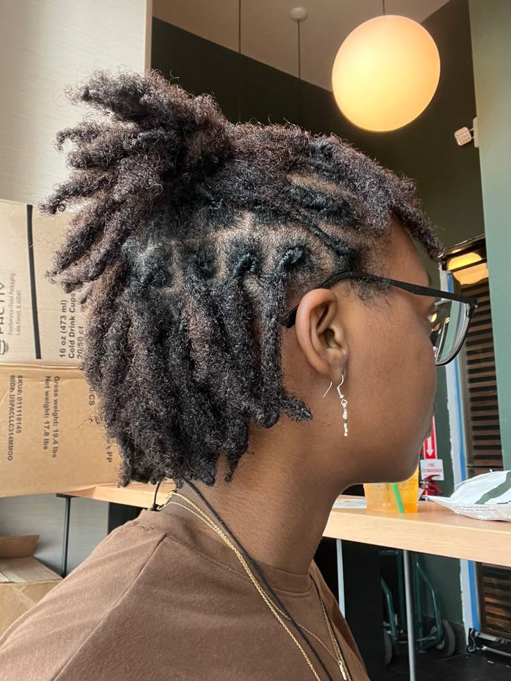 Starter locs on natural 4C hair showing healthy growth with minimal product buildup.