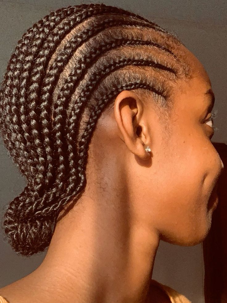 Straight-back cornrows on healthy natural 4C hair.