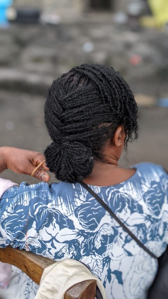 Black woman wearing healthy mature styled locs