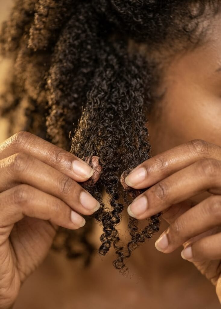 woman taking down her twist