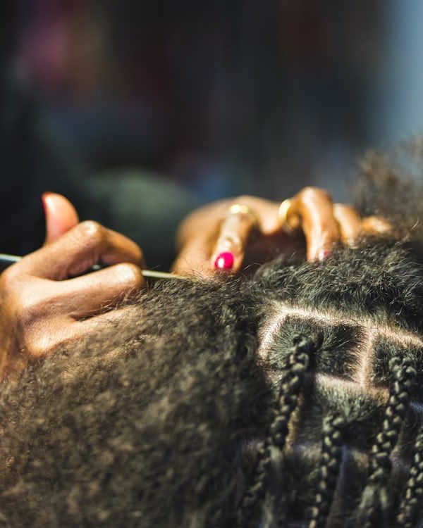 woman taking down her protective styling