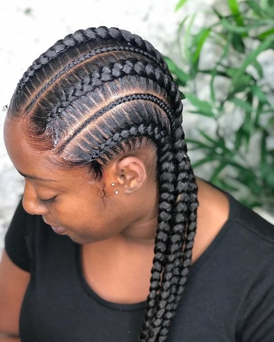 Thick and thin cornrow braids on healthy natural 4C hair.