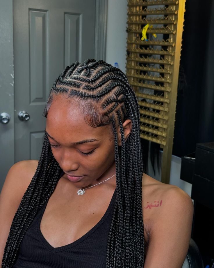 Traditional tribal braids on natural 4C hair.