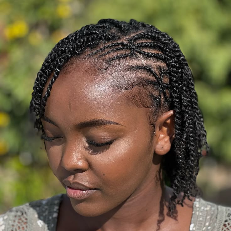 Twist hairstyle with side braids on natural 4C hair.