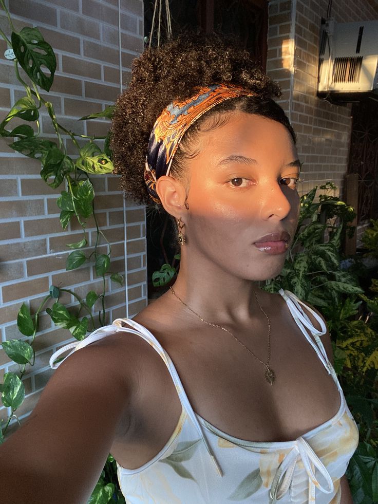 Wash-and-go styled with a satin scarf on natural 4C hair.