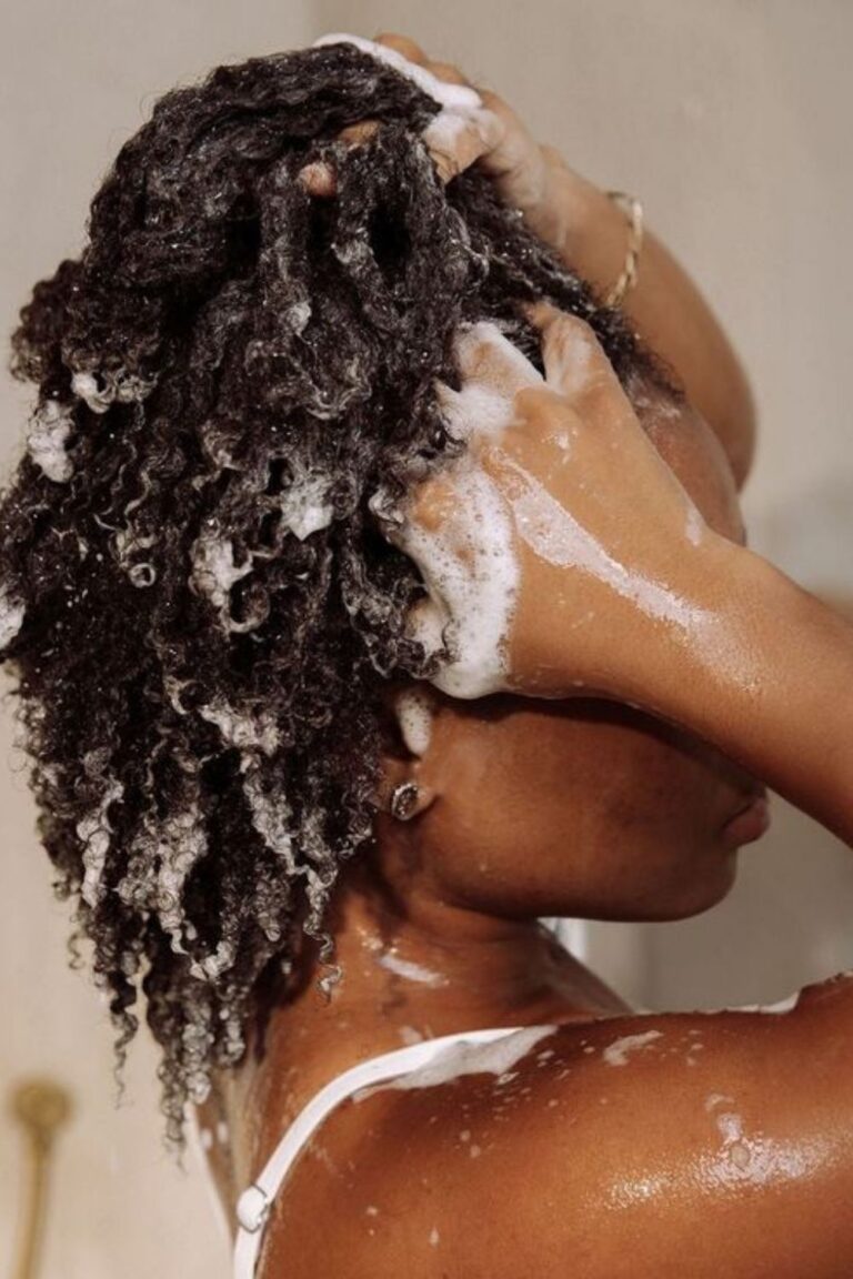 woman washing her nappy hair