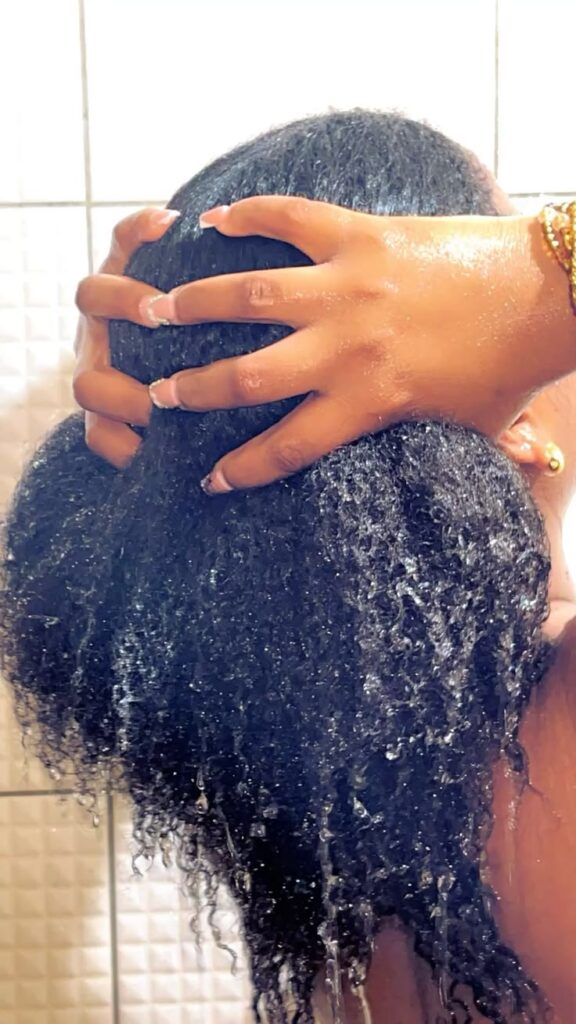 woman washing her hair before styling