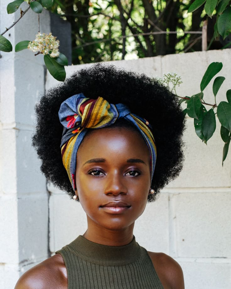 Natural 4C afro styled with a colourful cute head scarf