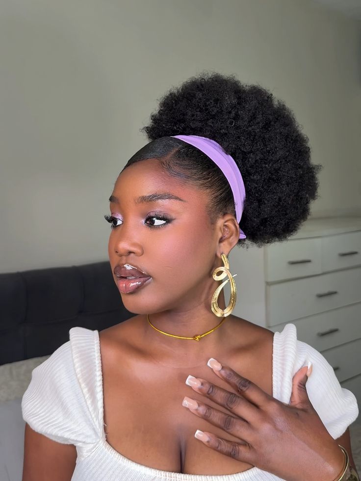 Natural 4C afro puff styled with a fabric headband