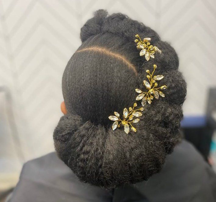 Textured natural 4C bridal updo with gold hair pins