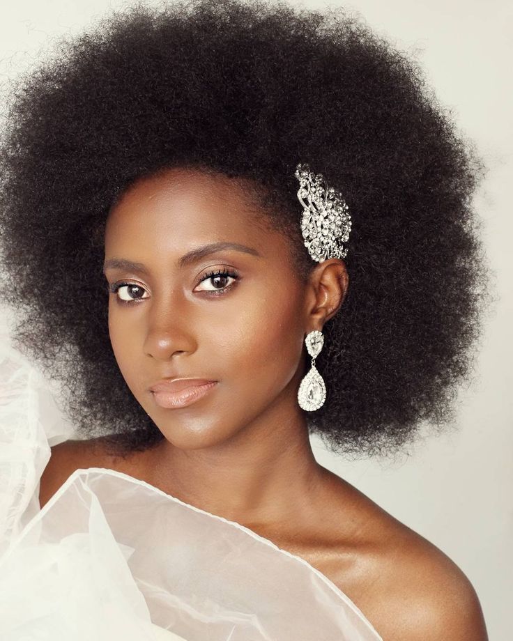 Natural 4C afro with elegant side hair accessory