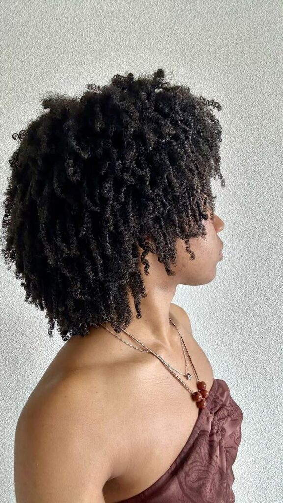 black woman with healthy hair after washing hair with sulfate free shampoo