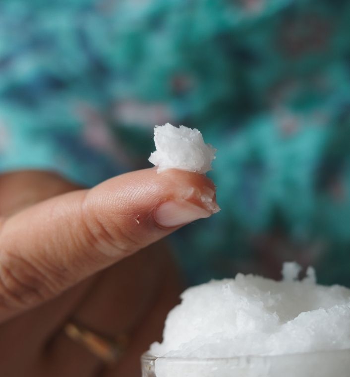 A small pea-sized amount of hair butter on fingertips.