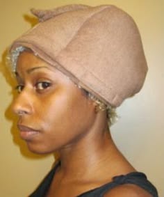 woman wearing an heating cap after deep conditioning