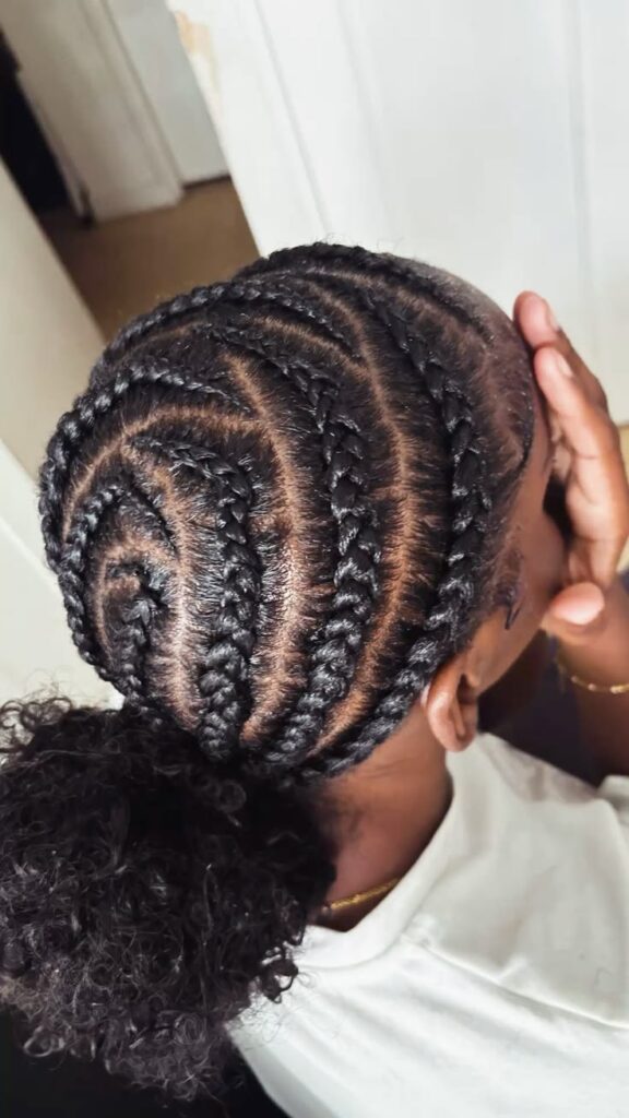 Natural 4C hair styled into a cute braided bun