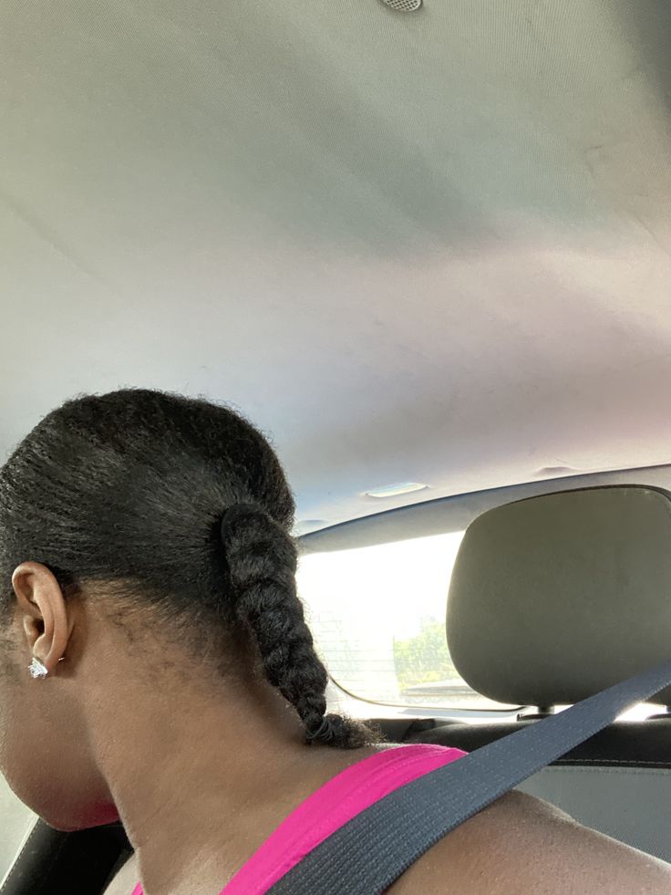 Natural 4C hair styled into a cute braided ponytail