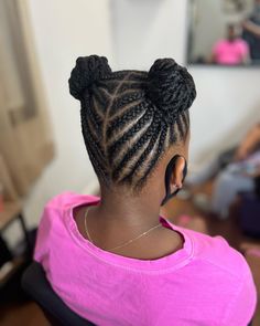 Braids styled into two space buns