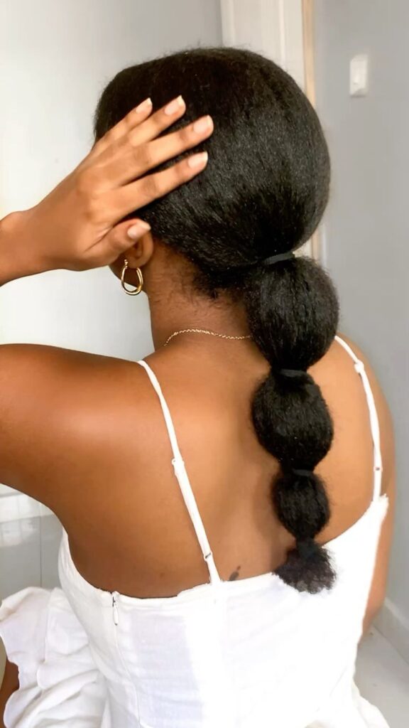 cute bubble ponytail created with natural 4C hair