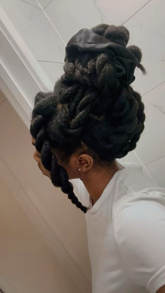 Chunky twists styled into an updo on natural 4C hair