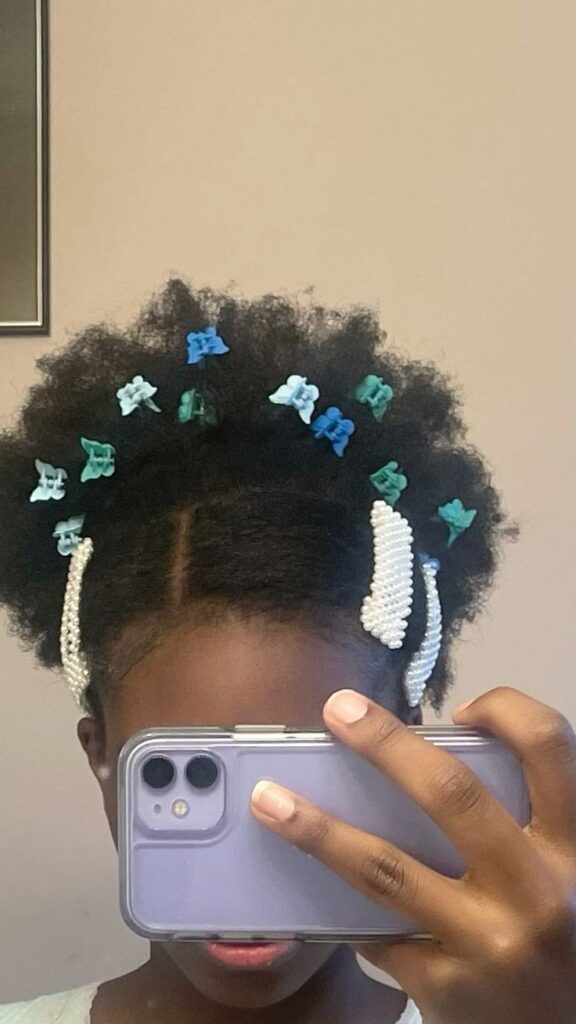 Natural 4C afro clipped back with hair accessories