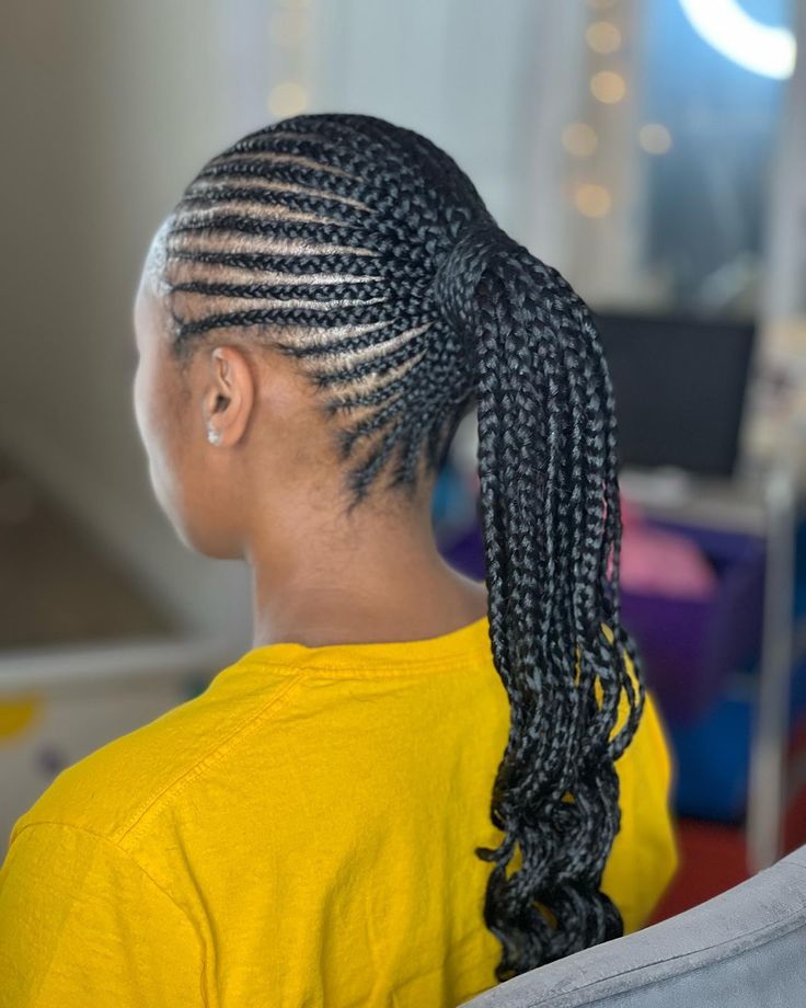 Cornrows leading into a ponytail