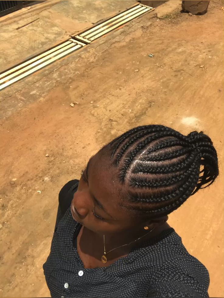 Cornrows gathered into a ponytail on natural 4C hair
