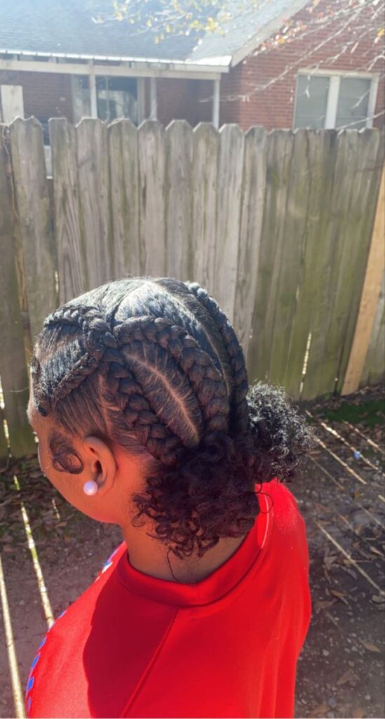 Natural 4C hair styled with criss-cross cornrows