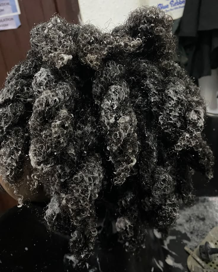Deep conditioner applied to sectioned natural 4C hair