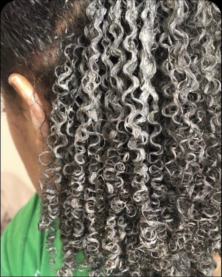 black woman deep conditioning hair to replace hair moisture
