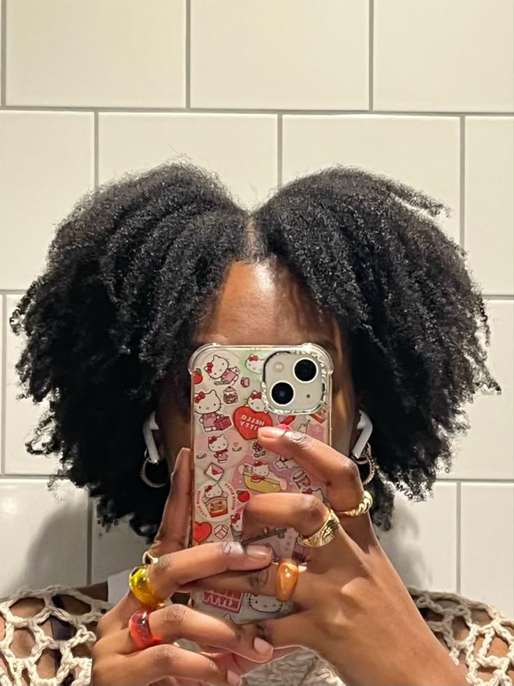 Woman wearing a defined wash-and-go on natural 4C hair