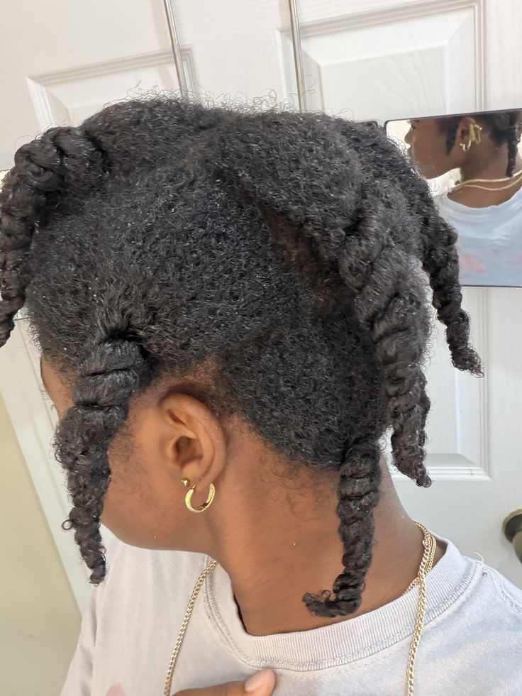 A woman with dense 4C hair preparing for a deep cleansing wash.
