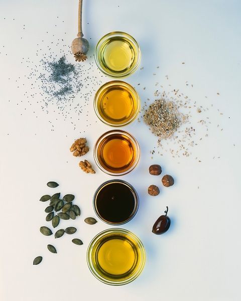 flat lay showing oils, measuring spoons,