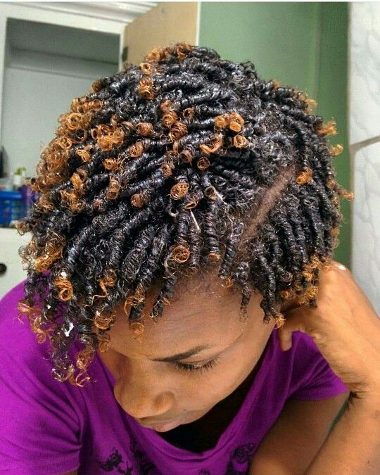 a woman on finger coils starter locs