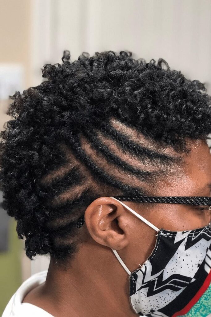 Natural 4C hair styled in a cute flat-twist frohawk