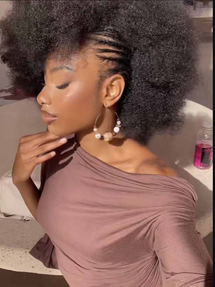 Natural 4C hair with a cute flat-twist side part
