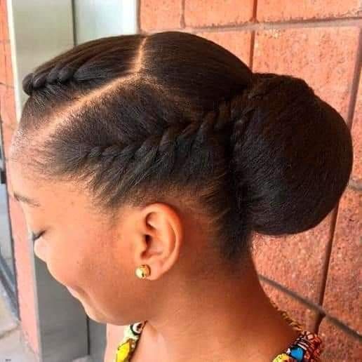 Flat twists leading into a bun on natural 4C hair