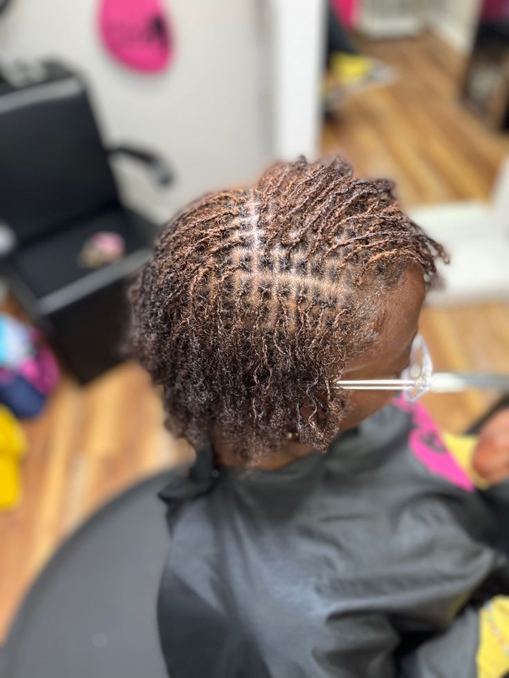 Freshly installed starter locs on natural 4C hair.