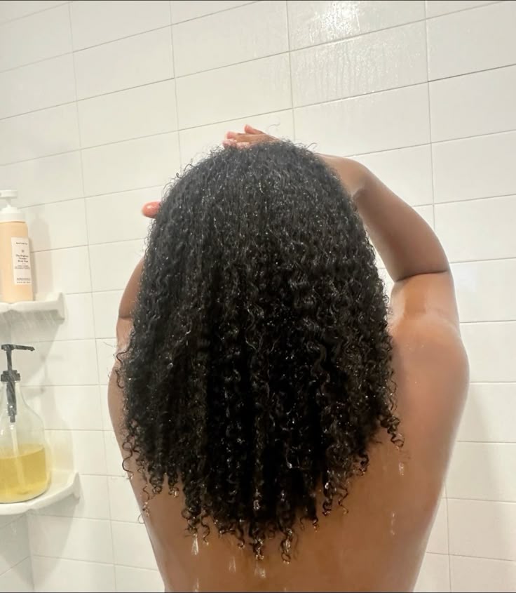 Woman following a gentle natural 4C hair wash day routine