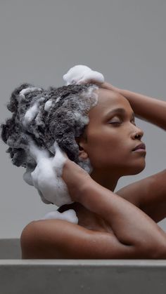 Gentle shampoo being applied to natural hair.