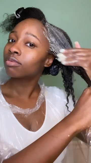 woman applying hair mask on hair