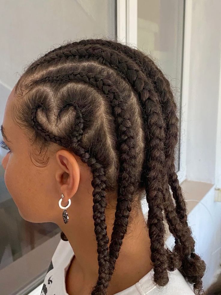 Natural 4C cornrows with a heart-shaped design