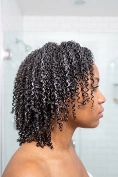 Low-porosity 4C hair weighed down by heavy styling products.