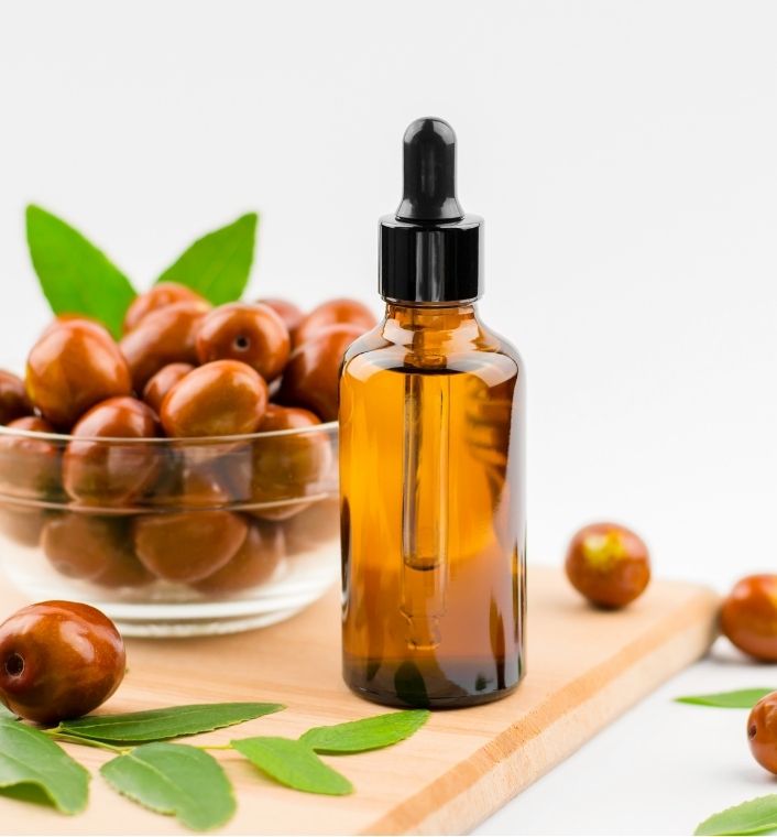 Jojoba oil being used for scalp massage