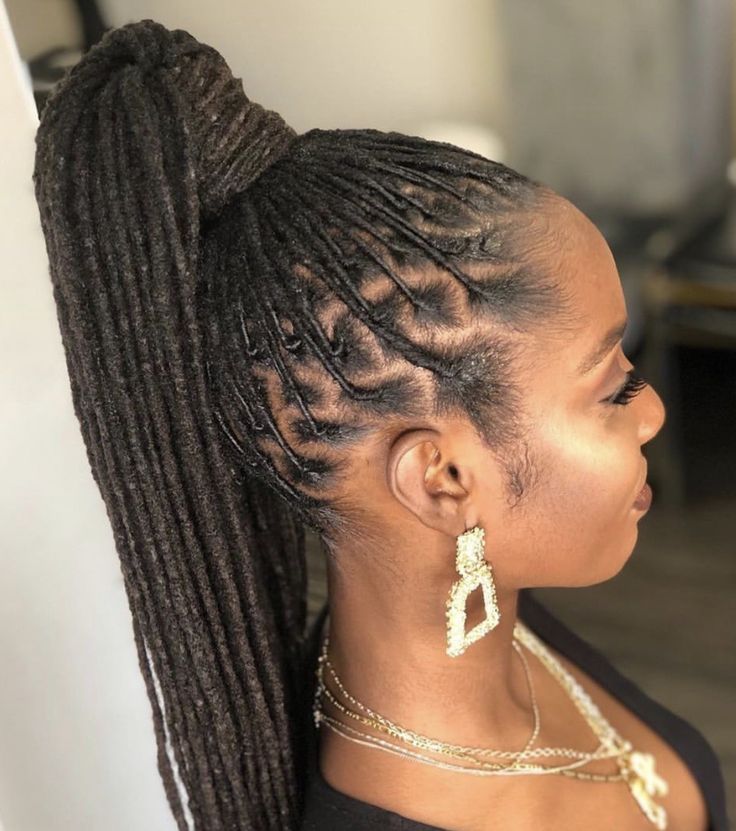 Locs styled into a natural ponytail
