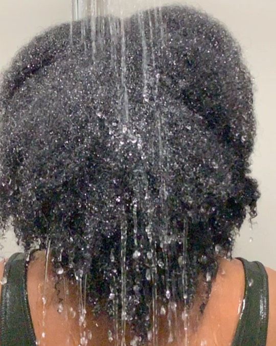 Low-porosity 4C hair resisting moisture during wash day.